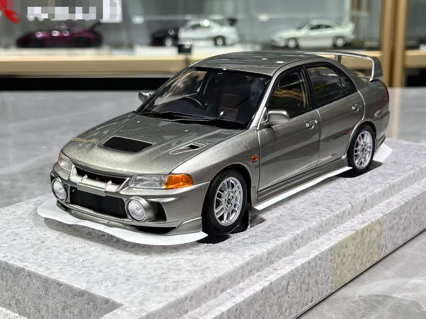 MotorHelix Mitsubishi Lancer EVO IV 1/18 – IronCookie Diecasts