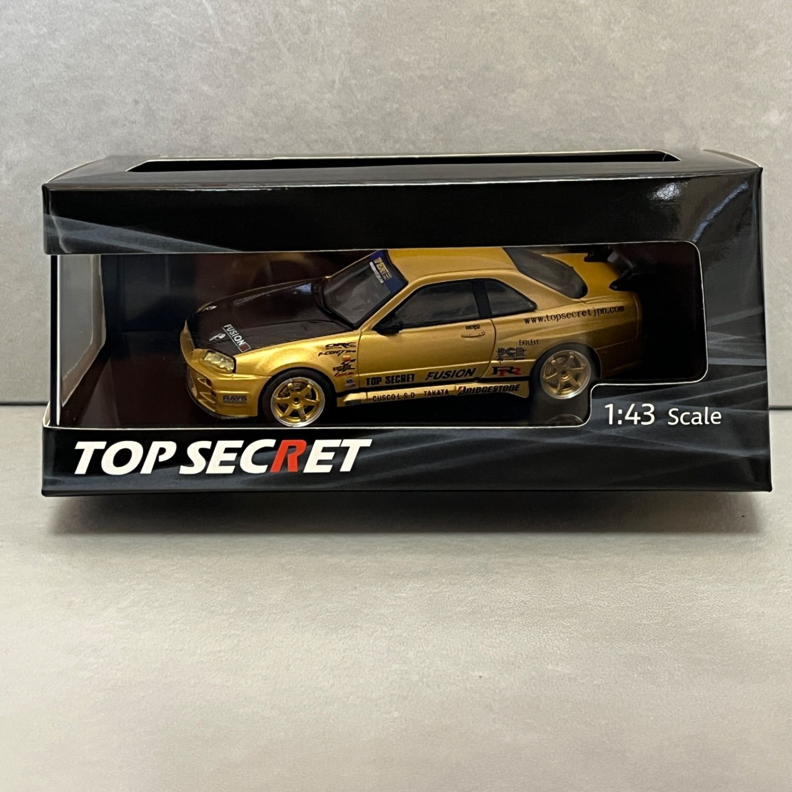 東京オートサロン 2026 限定 TOP SECRET R34 GT-R GOLD 1/43 - メルカリ