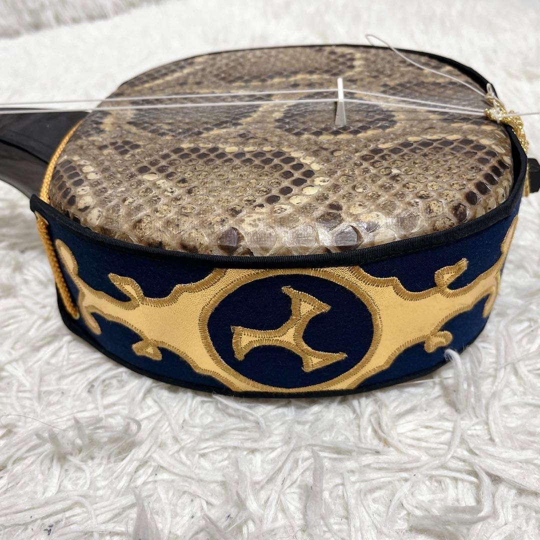 美品】 琉球本蛇皮 三味線 クロコ調 ハードケース 爪 琉球三味線