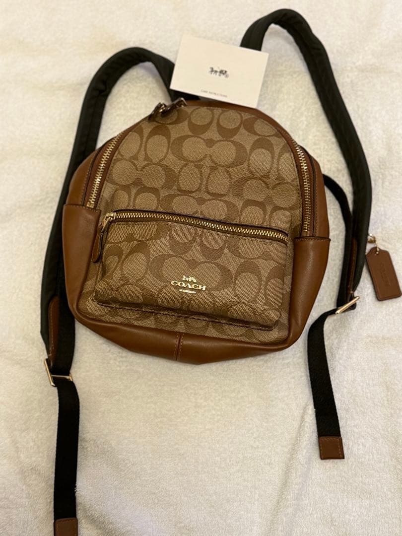 COACH ロゴプリント ブラウンレザーリュックの通販はau PAY マーケット