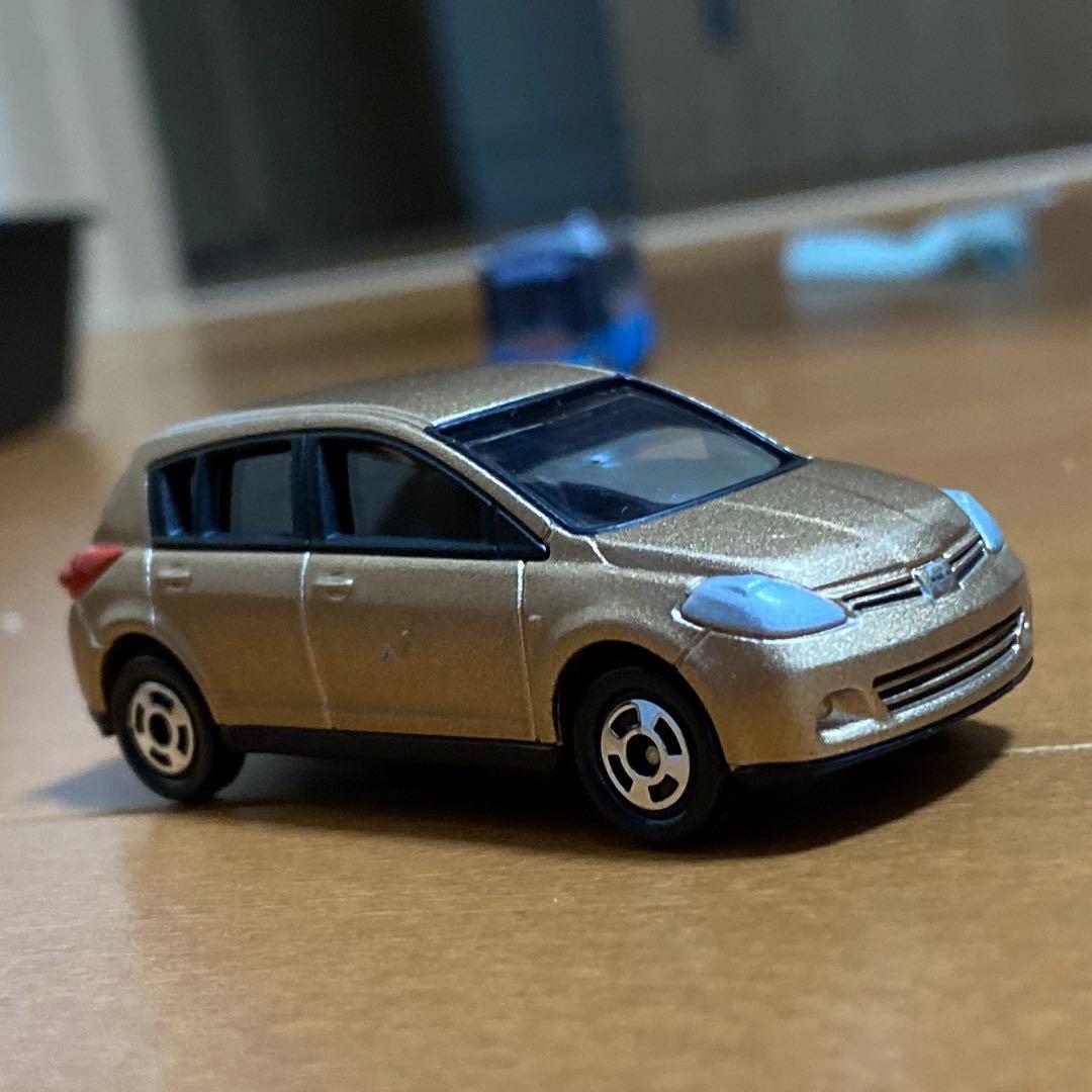 トミカ 日産 ティーダ ジャンパーニュゴールド - メルカリ