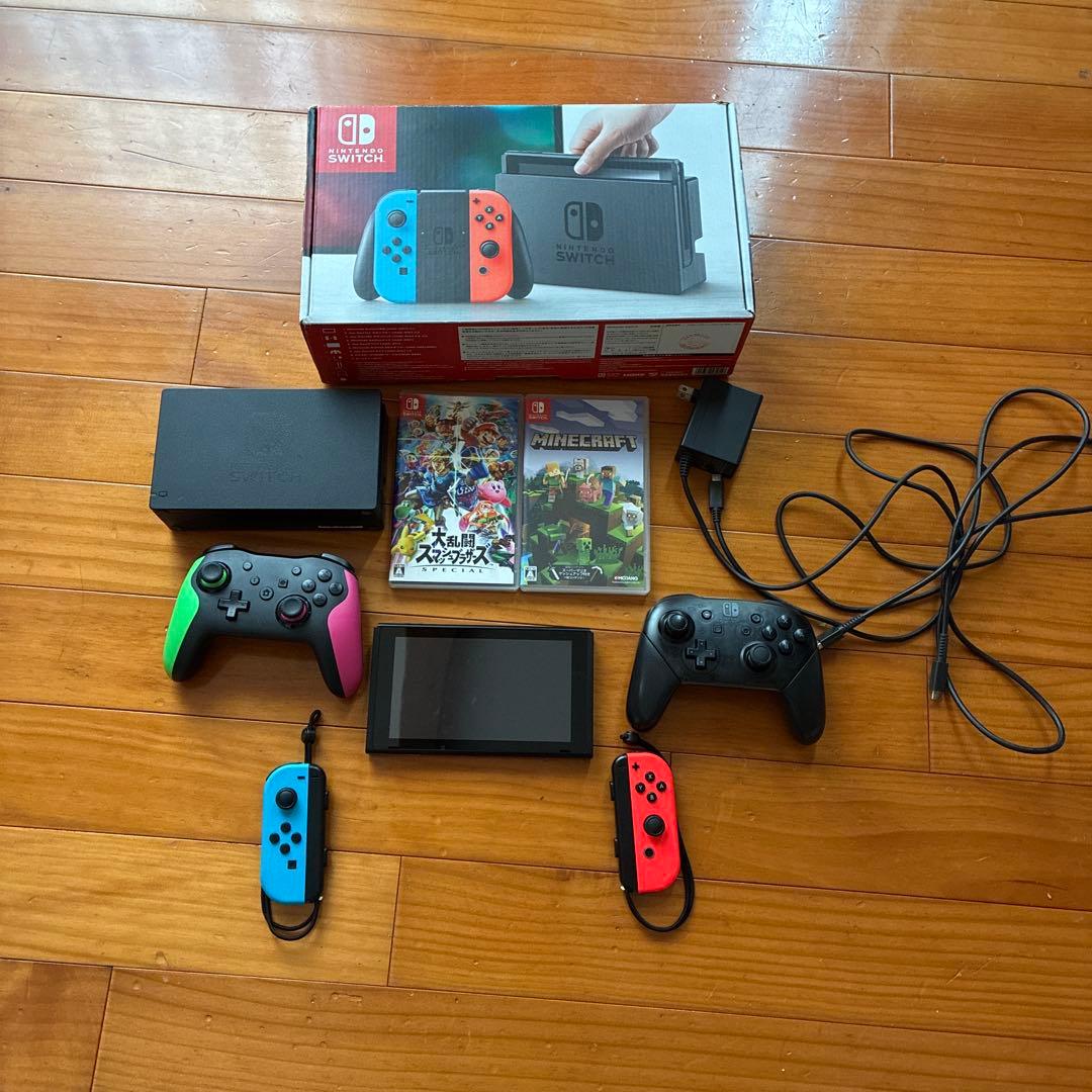 Nintendo Switch 本体とコントローラー2個セット カセット2個 - メルカリ