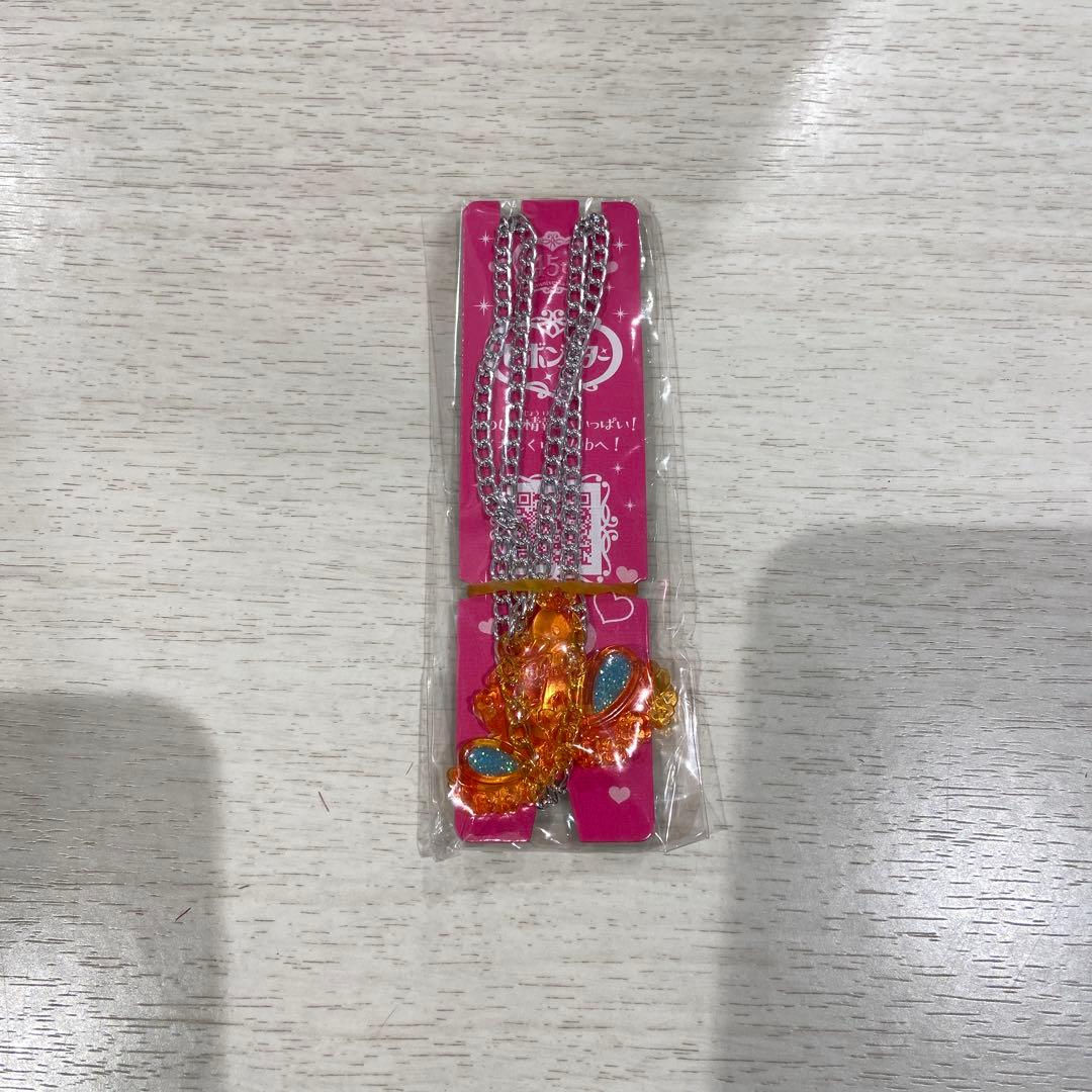 オレンジ花形ペンダントネックレス セボンスター - メルカリ